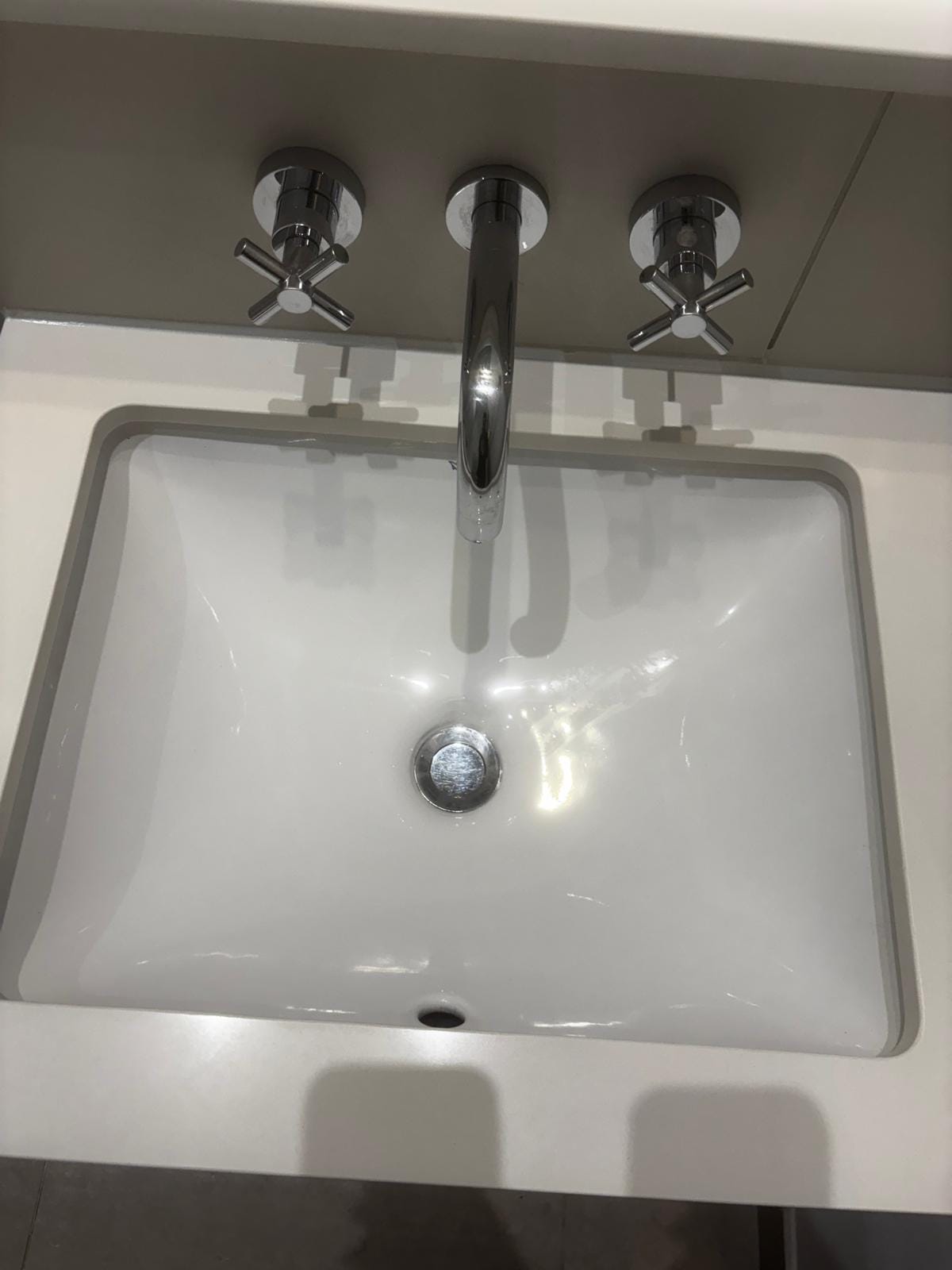 White bathroom basin with chrome taps