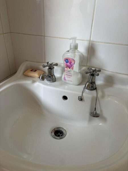 White basin with chrome taps
