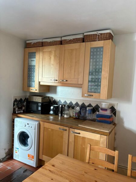 Pine kitchen with a washing machine