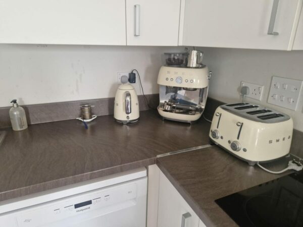 Kitchen worktop with a kettle and a coffee machine